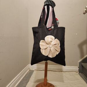 Elegant Black Tote Bag with Cream Floral Accent